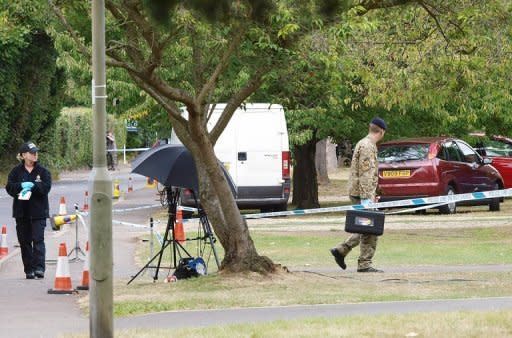 A British soldier from the bomb disposal squad prepares to enter the house of a British family shot dead in the French Alps, in Claygate, in south-east England, on Spetember 10. Police have evacuated neighbours and called in the bomb squad after finding a "potentially explosive substance" at the scene, a source told AFP Monday