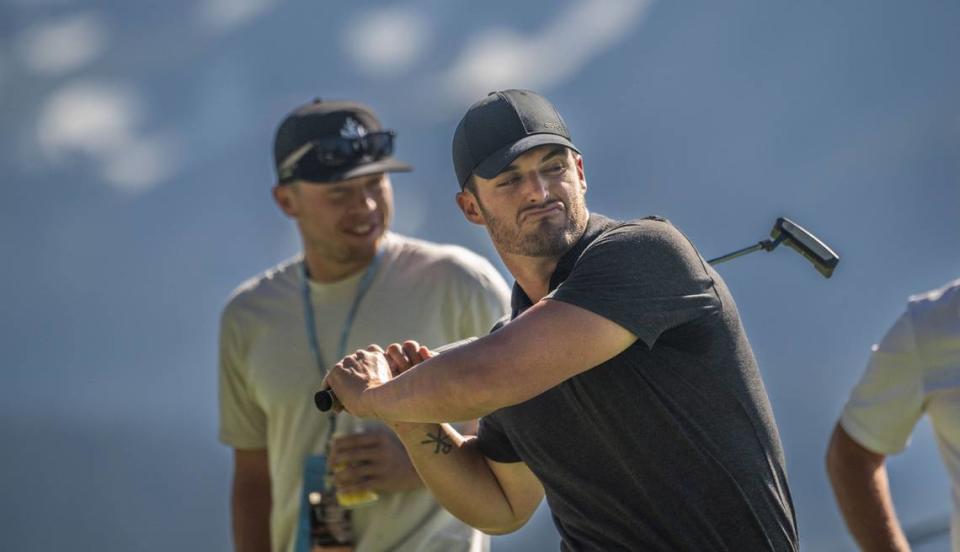 New Orleans Saints quarterback Derek Carr reacts Thursday, July 13, 2023, to a practice shot on the 17th hole at the American Century Championship celebrity golf tournament at Edgewood Tahoe Golf Course in Stateline, Nev.