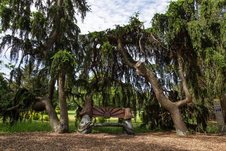 A mushroom shaped bench near the entrance to Fairy Forest at Yew Dell Botanical Gardens. May 11, 2023