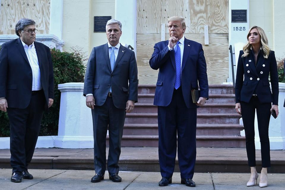 Bill Barr accompanied the president as police brutally removed protesters so he could take a photo at a church following riots in DC. Source: Getty