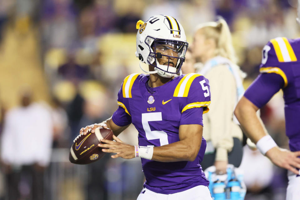 Nov 18, 2023; Baton Rouge, Louisiana, USA; Heisman Trophy candidate LSU Tigers quarterback Jayden Daniels (5) warms up before their game against the Georgia State Panthers at Tiger Stadium. Mandatory Credit: Matthew Dobbins-USA TODAY Sports