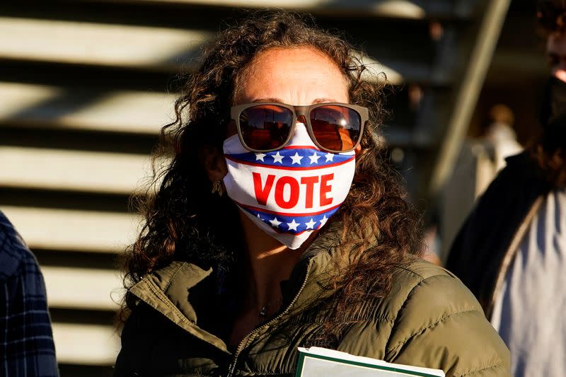 Heather Crim waits in line to cast her ballot during early voting at ONEOK Field in Tulsa