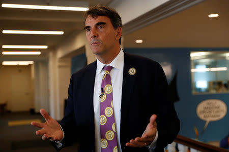 Venture capitalist and CAL 3 Chairman Tim Draper speaks during a press conference after announcing he has collected more than 600,000 signatures to put the plan to partition California into three states into the November ballot in San Mateo, California, April 12, 2018. REUTERS/ Stephen Lam