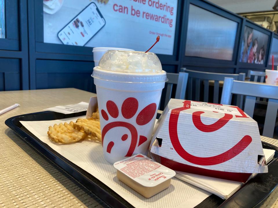 A peach milkshake from Chick-fil-A is featured in a tray of food. The fast-food company recently announced that the city of Lafayette had the more orders of peach milkshakes in 2021 than any other U.S. city.