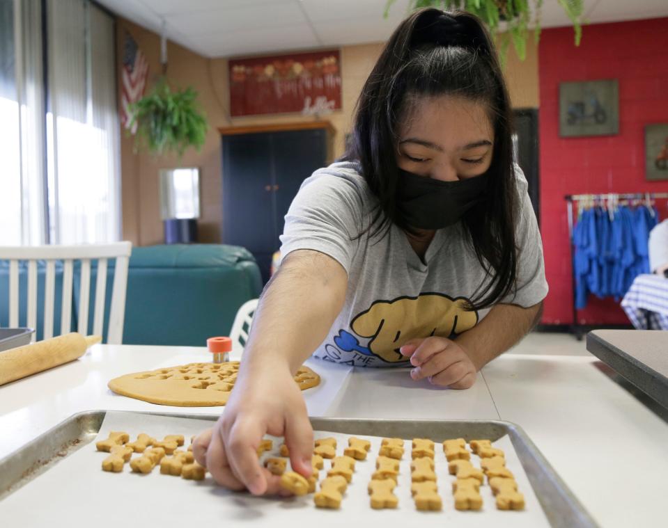 Sixteen-year-old Jashne Baniya's favorite parts of working at the Gahanna Barkery, a micro business started out of Gahanna Lincoln High School, are finding the ingredients for the dog treats at the grocery store and working with the dough.