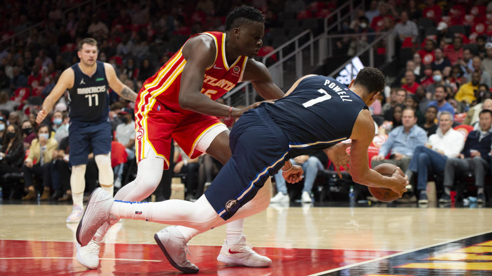 Atlanta Hawks' Clint Capela (15) knocks Dallas Mavericks' Dwight Powell (7) out of bounds during the second half of an NBA basketball game Thursday, Oct. 21, 2021, in Atlanta. (AP Photo/Hakim Wright Sr.)