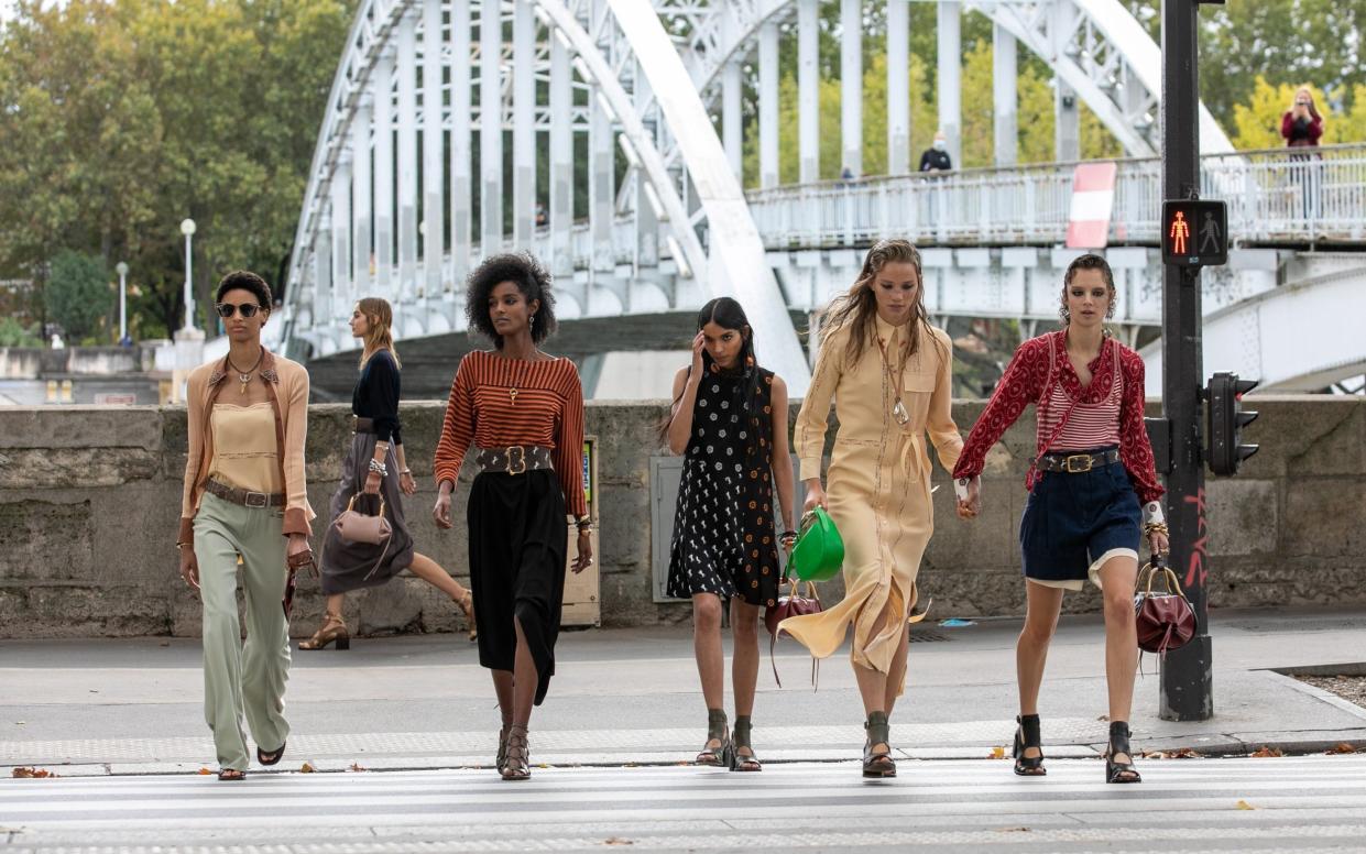 Chloe models walk through the streets of Paris - Getty