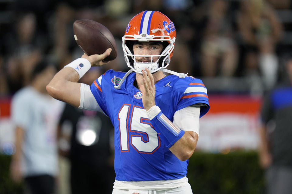 Florida quarterback Graham Mertz (15) warms up before an NCAA college football game against Central Florida, Saturday, Oct. 5, 2024, in Gainesville, Fla. (AP Photo/John Raoux)