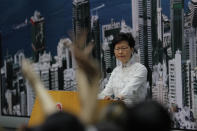 Hong Kong's Chief Executive Carrie Lam takes questions at a press conference, Saturday, June 15, 2019, in Hong Kong. Lam said she will suspend a proposed extradition bill indefinitely in response to widespread public unhappiness over the measure, which would enable authorities to send some suspects to stand trial in mainland courts. (AP Photo/Kin Cheung)