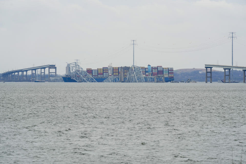 A container ship rests against the wreckage of the Francis Scott Key Bridge on Thursday, March 28, 2024, in Baltimore, Md. The ship rammed into the major bridge in Baltimore early Tuesday, causing it to collapse in a matter of seconds and creating a terrifying scene as several vehicles plunged into the chilly river below. (AP Photo/Matt Rourke)