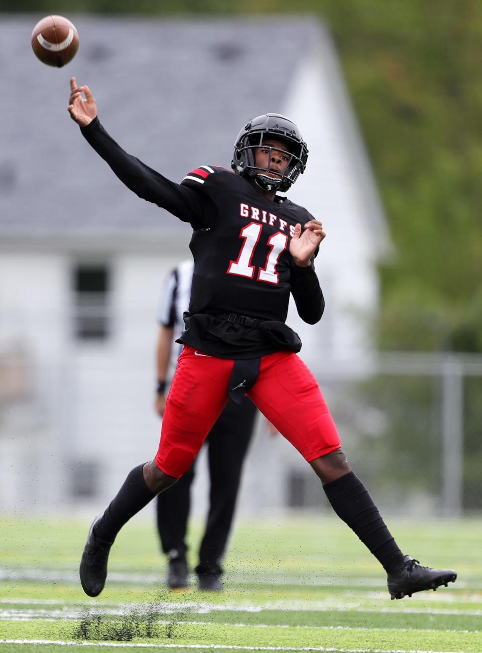 Buchtel quarterback Stevie Diamond throws on the run during the second half of a high school football game against Ellet on Saturday, Sept. 24, 2022, in Akron, Ohio.