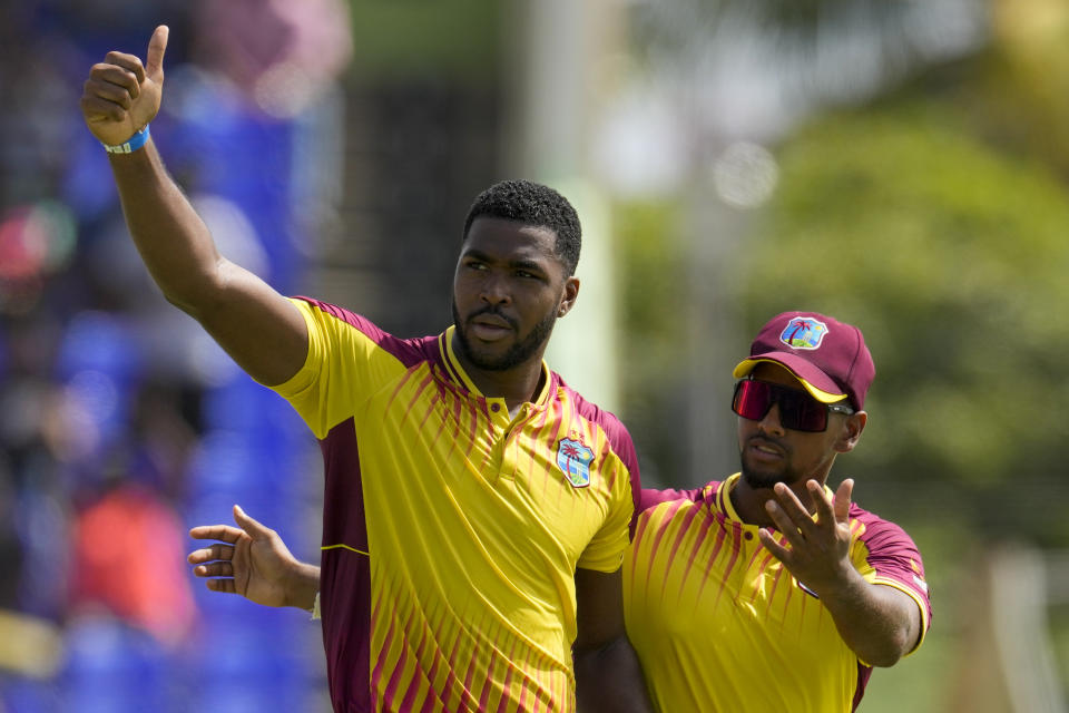 West Indies' Obed McCoy celebrates taking the wicket of India's Ravindra Jadeja during the second T20 cricket match at Warner Park in Basseterre, St. Kitts and Nevis, Monday, Aug. 1, 2022. (AP Photo/Ricardo Mazalan)
