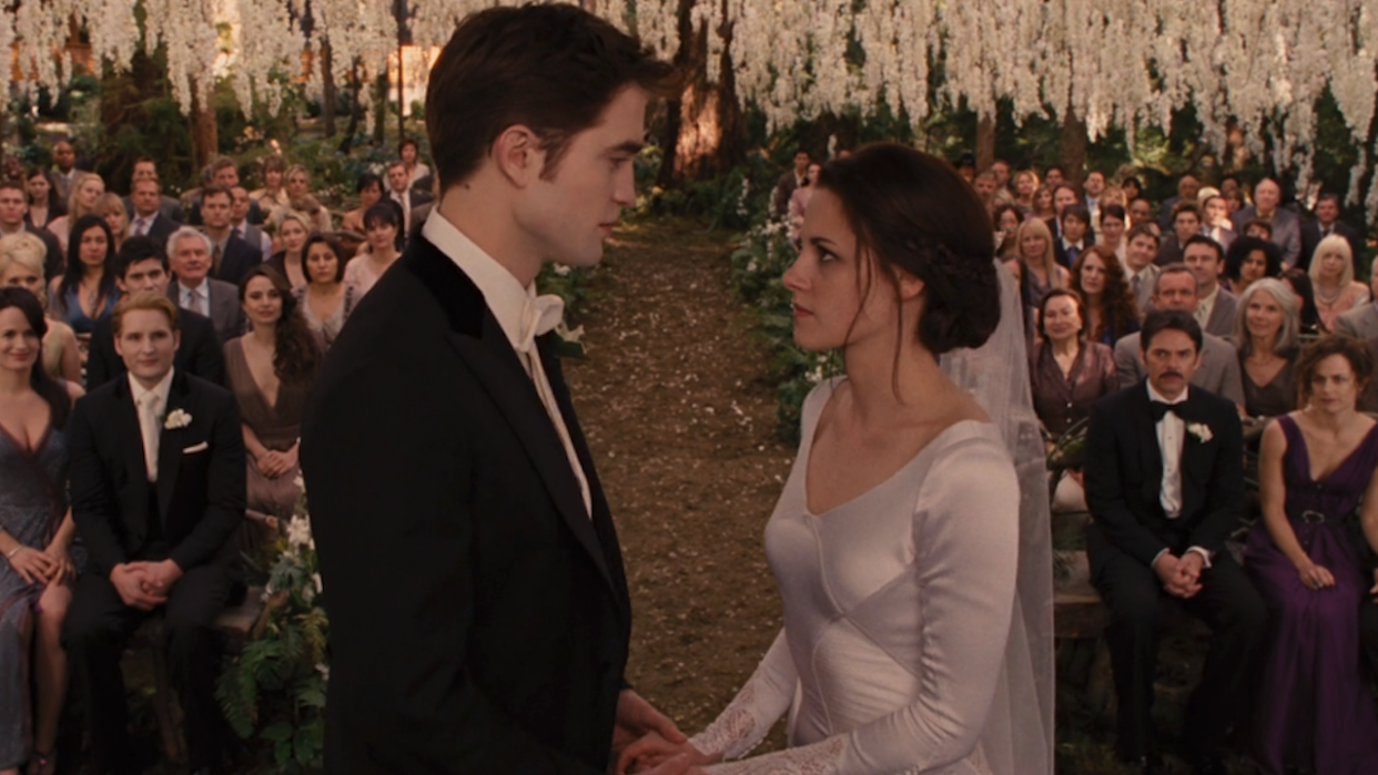  Kristen Stewart and Robert Pattinson as Bella and Edward getting married in Breaking Dawn Part 1. 