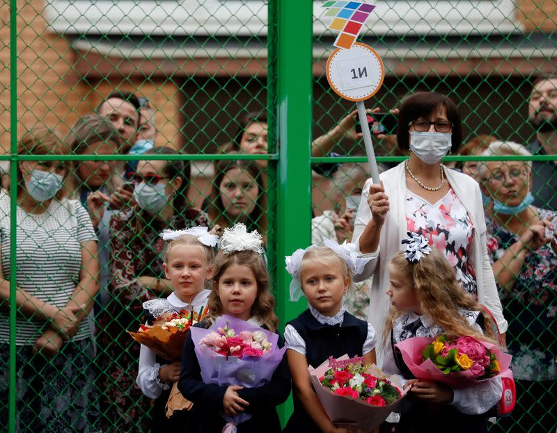 FILE PHOTO: First graders attend a ceremony marking the start of the new school year in Moscow