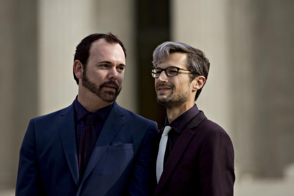 David Mullins (left) and husband Charlie Craig wait to speak to supporters after U.S. Supreme Court arguments in the Masterpiece Cakeshop v. Colorado Civil Rights Commission case in Washington, D.C. on Dec. 5, 2017. (Photo: Bloomberg via Getty Images)