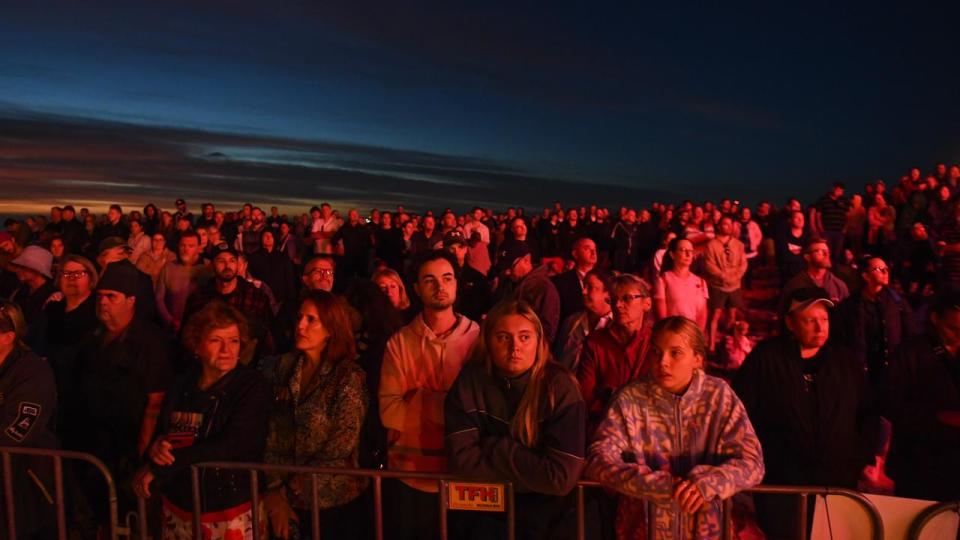 Crowds are seen during the Anzac Day Dawn Service at Elephant Rock