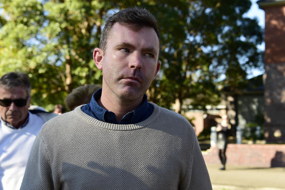 Nicholas Warby leaves Hornsby Local Court in Sydney, Tuesday, August 6, 2019. A teacher from Sydney's prestigious Knox Grammar School has been charged after multiple child abuse images were allegedly found on his phone left at a pool. 