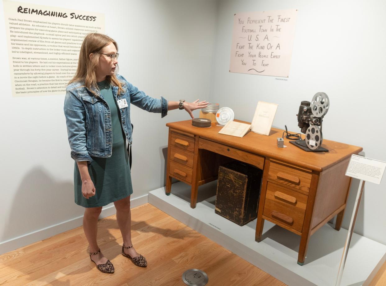 Bailey Yoder, curator of football heritage at the Massillon Museum, talks about a desk from Paul Brown's Massillon coaching era along with a projector, game films and scouting reports Brown used. The museum's newest exhibit, "A Way to Win: Paul Brown's Innovations," showcases the man many credit for modernizing football.