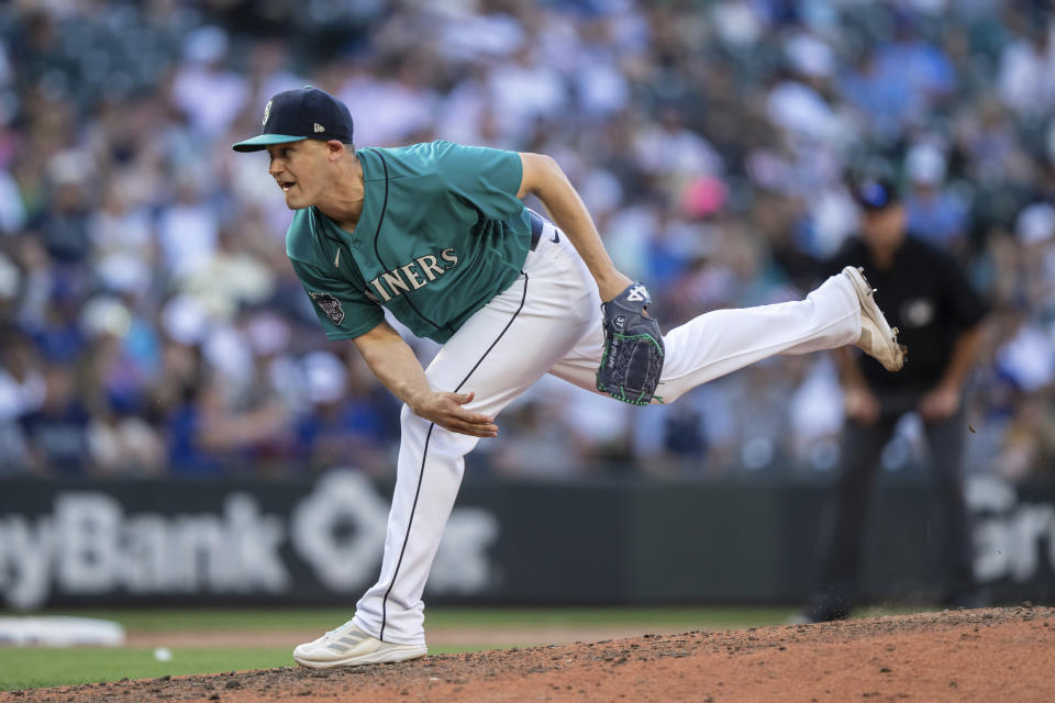 Seattle Mariners reliever Paul Sewald watches a throw during the eighth inning of the team's baseball game against the Tampa Bay Rays, Saturday, July 1, 2023, in Seattle. The Mariners won 8-3. (AP Photo/Stephen Brashear)