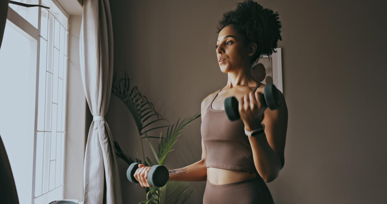 Woman using dumbbells to exercise