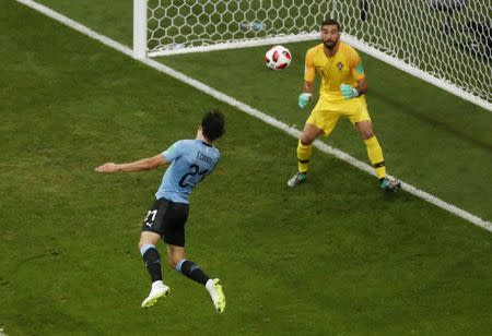 Soccer Football - World Cup - Round of 16 - Uruguay vs Portugal - Fisht Stadium, Sochi, Russia - June 30, 2018 Uruguay's Edinson Cavani scores their first goal past Portugal's Rui Patricio. REUTERS/Sergio Perez