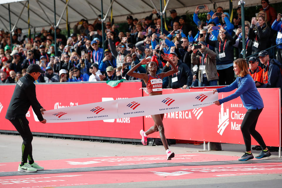 Kenya's Brigid Kosgei crosses the finish line as she wins the women's 2019 Bank of America Chicago Marathon on Oct. 13, 2019. | Kamil Krzaczynski—AFP/Getty Images