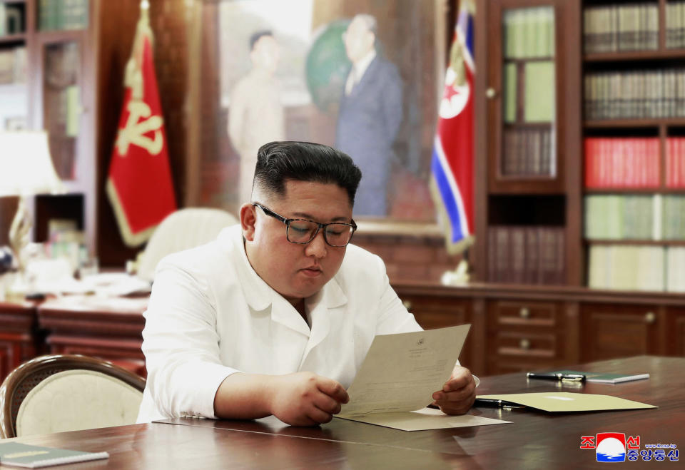 In this undated photo provided on Sunday, June 23, 2019, by the North Korean government, North Korean leader Kim Jong Un reads a letter from U.S. President Donald Trump. Independent journalists were not given access to cover the event depicted in this image distributed by the North Korean government. The content of this image is as provided and cannot be independently verified. Korean language watermark on image as provided by source reads: "KCNA" which is the abbreviation for Korean Central News Agency. (Korean Central News Agency/Korea News Service via AP)