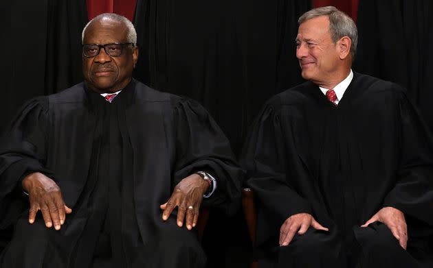 Supreme Court Chief Justice John Roberts (right) and Justice Clarence Thomas both concurred in the court's opinion that Donald Trump enjoys complete immunity for 