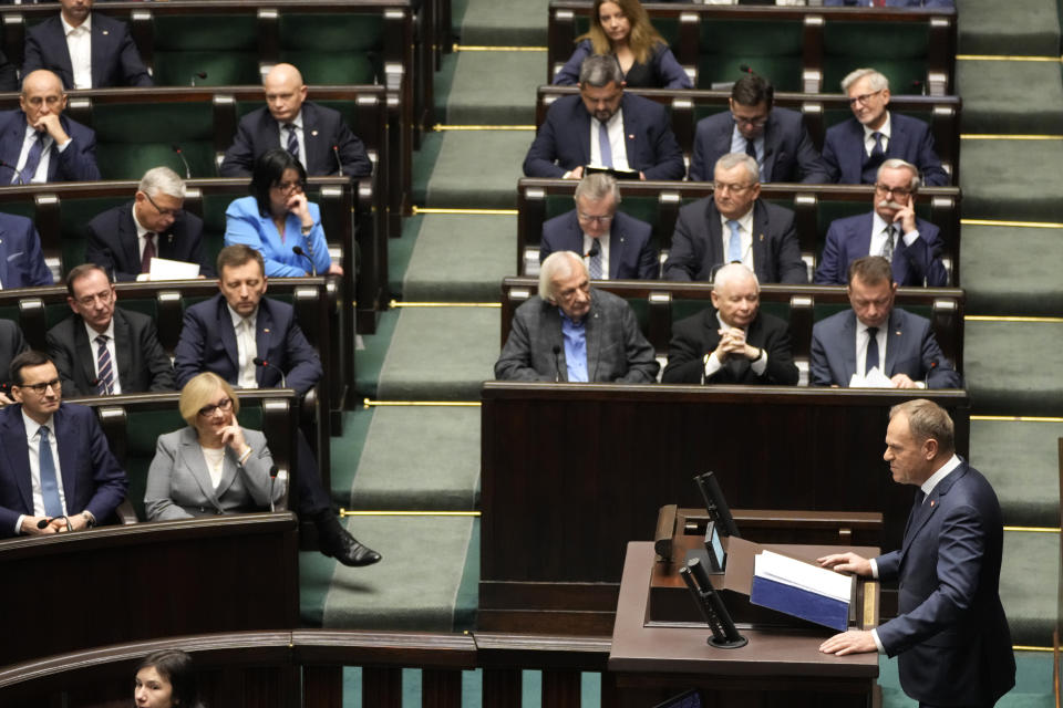 Newly elected Poland's Prime Minister Donald Tusk addresses lawmakers during his speech at the parliament in Warsaw, Poland, Tuesday Dec. 12, 2023. (AP Photo/Czarek Sokolowski)