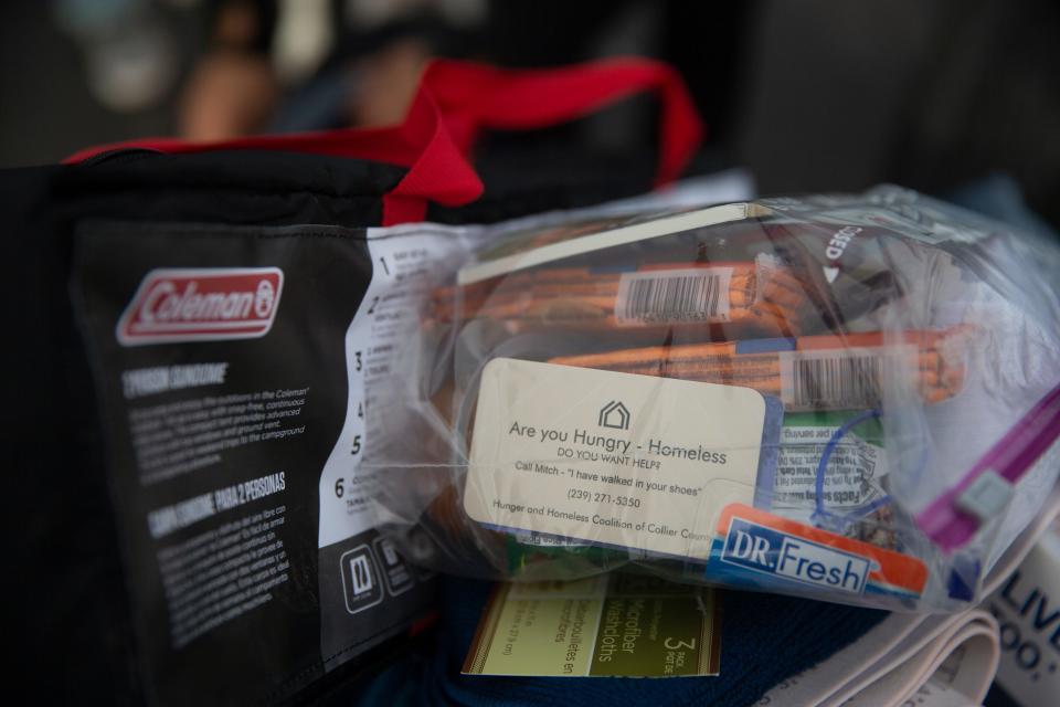 Food and supplies were given away at the Collier County Hunger and Homeless CoalitionÕs annual "point in time" homeless count at Gulf Gate Plaza in Naples on Friday, Jan. 26, 2024. Vendors were set up at the event to help the homeless which included, food, hygiene kits, clothes and other help.