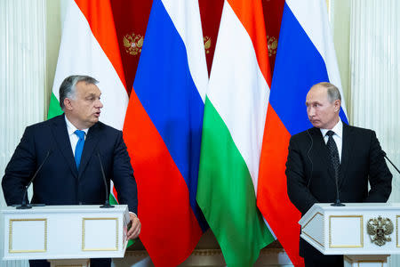 Hungarian Prime Minister Viktor Orban and Russian President Vladimir Putin attend a joint news conference following their talks at the Kremlin in Moscow, Russia September 18, 2018. Alexander Zemlianichenko/Pool via REUTERS