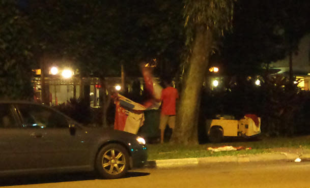 Flags spotted in a mobile garbage bin. (Photo courtesy of Jeff Leong)