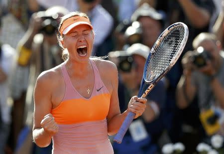 Maria Sharapova of Russia reacts after winning her women's singles final match against Simona Halep of Romania at the French Open tennis tournament at the Roland Garros stadium in Paris June 7, 2014. REUTERS/Vincent Kessler