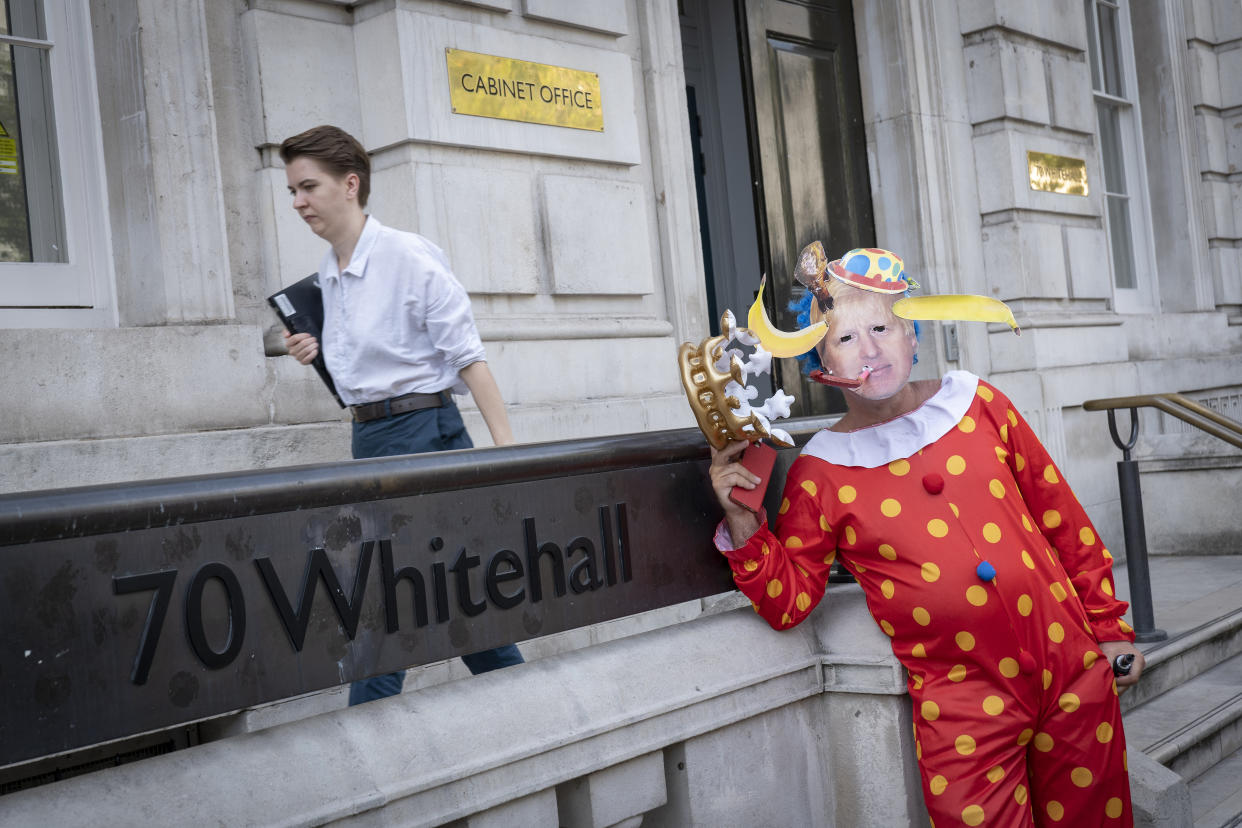 Anti-Brexit campaigner dressed as a clown impersonates Prime Minister Boris Johnson outside the Cabinet Office on Whitehall on the 29th August 2019 in London in the United Kingdom. A group gather outside the Cabinet Office, protesting against British Prime Minster Boris Johnsons announcement of a suspension of Parliament. (photo by Sam Mellish / In Pictures via Getty Images)