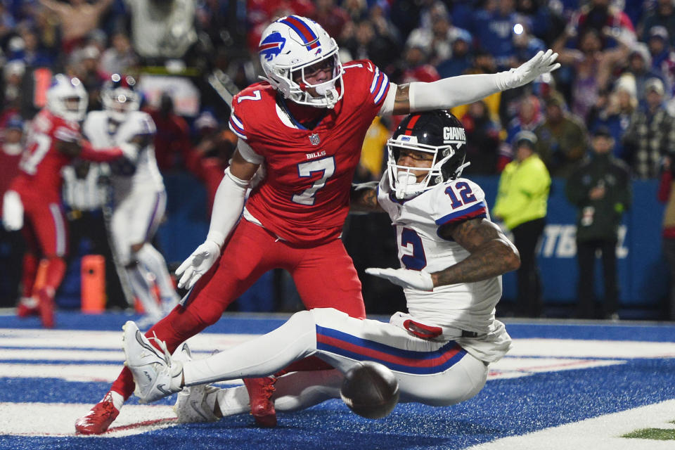 Buffalo Bills cornerback Taron Johnson (7) breaks up a pass to New York Giants tight end Darren Waller (12) on the final play of an NFL football game in Orchard Park, N.Y., Sunday, Oct. 15, 2023. The Bills defeated the Giants 14-9. (AP Photo/Adrian Kraus)