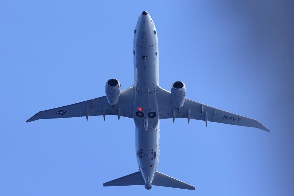 A U.S. Navy plane flies over the areas of Second Thomas Shoal, locally known as Ayungin Shoal, at the disputed South China Sea while Chinese coast guard ships try to block Philippine coast guard and supply ships during a rotation and resupply mission on Tuesday, Aug. 22, 2023. As a U.S. Navy plane circled overhead, two Philippine navy-manned boats manage to breach through a Chinese coast guard blockade in a dangerous confrontation in the disputed South China Sea and succeeded in delivering food and other supplies to Filipino forces guarding a contested shoal on board BRP Sierra Madre. (AP Photo/Aaron Favila)