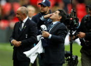 Soccer Football - Premier League - Tottenham Hotspur vs Liverpool - Wembley Stadium, London, Britain - October 22, 2017 Diego Maradona is presented on the pitch at half time as Ossie Ardiles looks on Action Images via Reuters/Matthew Childs