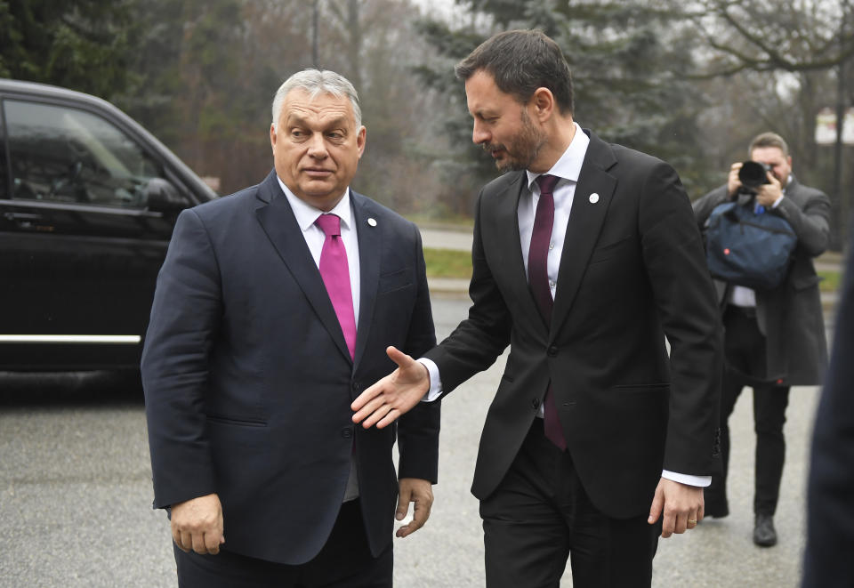 Slovakia's Prime Minister Eduard Heger, right, greets Hungarian Prime Minister Viktor Orban prior to the summit summit of Visegrad Group (V4) prime ministers in Kosice, Slovakia, Thursday Nov. 24, 2022. The leaders of the Visegrad Four group of Central European countries will discuss the current situation in Europe in the wake of the Russian aggression in Ukraine and the energy crisis. (Frantisek Ivan/TASR via AP)