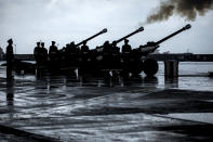 Royal Gibraltar Regiment fire the Death Gun Salute marking the death of the Duke of Edinburgh in Gibraltar, on Saturday April 10, 2021. Britain's Prince Philip, the irascible and tough-minded husband of Queen Elizabeth II who spent more than seven decades supporting his wife in a role that mostly defined his life, died on Friday. (AP Photo/Javier Fergo)