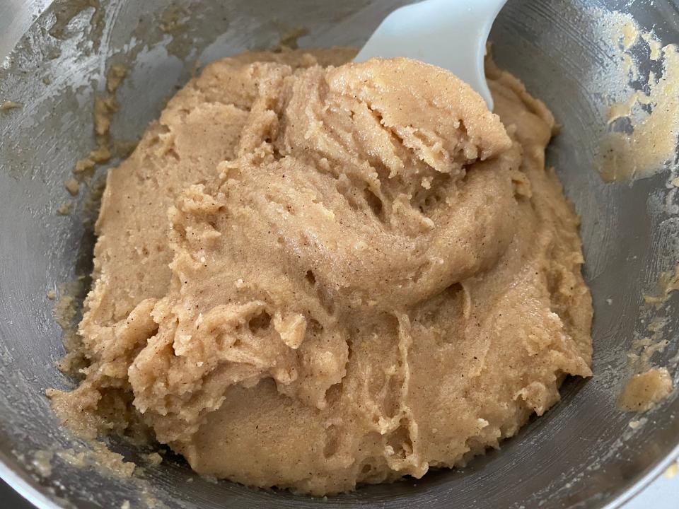 Pumpkin bread dough in a bowl.