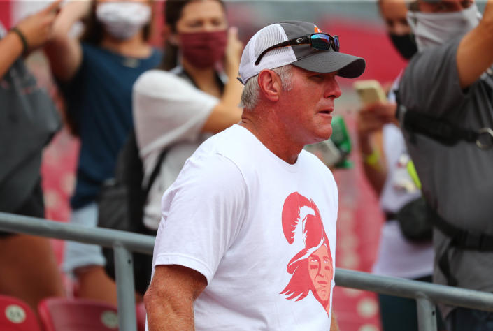 Brett Favre in baseball cap and T-shirt.