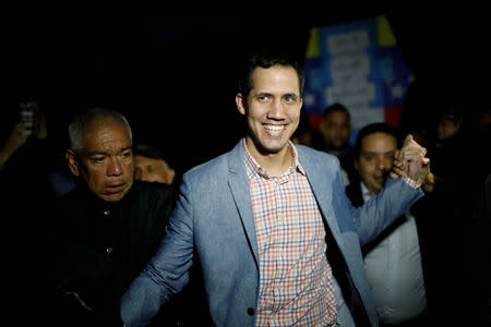 FILE PHOTO: Juan Guaido, President of Venezuela's National Assembly, greets supporters during a gathering in Caracas, Venezuela January 16, 2019. REUTERS/Carlos Garcia Rawlins/File Photo