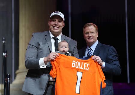 Apr 27, 2017; Philadelphia, PA, USA; Garett Bolles (Utah) holds his son Kingston Bolles as he poses with NFL commissioner Roger Goodell as he is selected as the number 20 overall pick to the Denver Broncos in the first round the 2017 NFL Draft at the Philadelphia Museum of Art. Bill Streicher-USA TODAY Sports