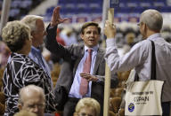 FILE - In this May 17, 2013, file photo, candidate for Governor of Virginia, Pete Snyder, center, gestures as he talks to delegates during the opening of the Virginia Republican convention in Richmond, Va. Tens of thousands of Virginians are casting ballots to choose nominees for governor and other statewide offices. The Republican Party is holding what it's calling an “unassembled convention” on Saturday, May 8, 2021, to select its nominees in this year's race for governor, lieutenant governor, and attorney general. Republicans haven't won a statewide race in Virginia since 2009. (AP Photo/Steve Helber, File)