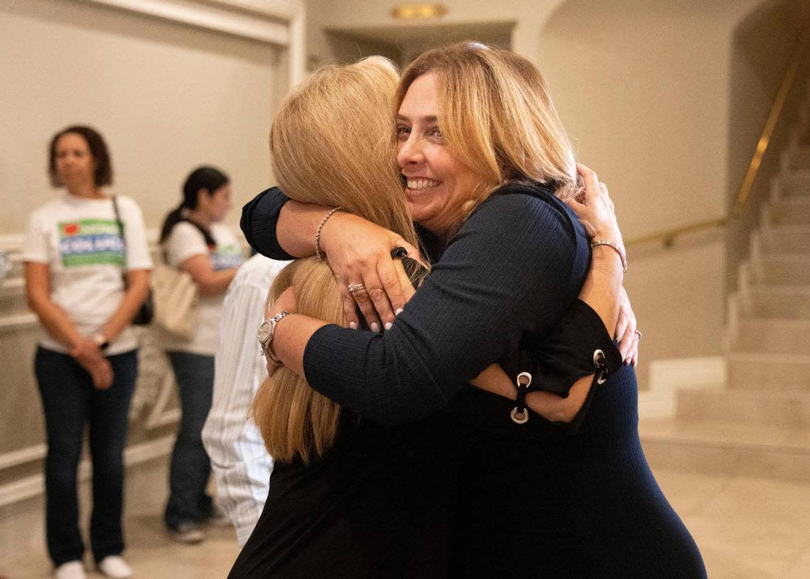 Monica Colucci, running for the District 8 Miami-Dade School Board seat against longtime incumbent Marta Perez, hugs a supporter at her watch party at the Renaissance Ballrooms on Tuesday, Aug. 23, 2022, in West Miami. As of late Tuesday, Colucci, a district teacher who was backed by Gov. Ron DeSantis and Lt. Gov. Jeanette Nuñez, had won with more than 50 percent of the vote.