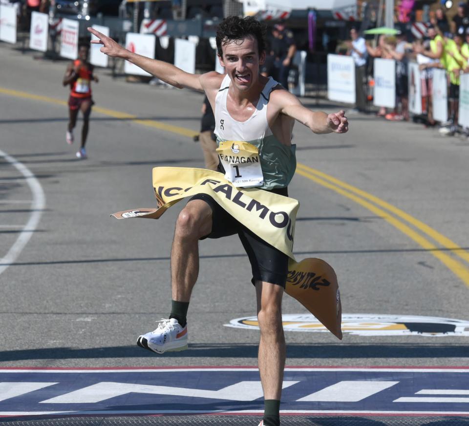 Ben Flanagan leaps into the finish banner in 32:25 minutes winning the race with a big smile at the 50th running of the Falmouth Road Race on Sunday.