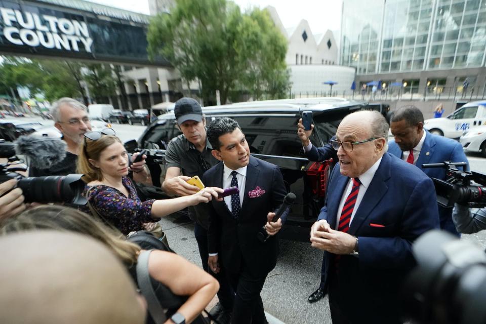 Former New York Mayor Rudy Giuliani arriving at the Fulton County Courthouse in Atlanta, Ga., on Aug. 17, 2022, to appear before the special grand jury investigating efforts to overturn the 2020 election. <a href="https://newsroom.ap.org/detail/GeorgiaElectionInvestigation/e57d949e422646d8b46e78ca8ac56f99/photo?Query=georgia%20election%20investigation&mediaType=photo&sortBy=arrivaldatetime:desc&dateRange=Anytime&totalCount=239&currentItemNo=13" rel="nofollow noopener" target="_blank" data-ylk="slk:AP Photo/John Bazemore;elm:context_link;itc:0;sec:content-canvas" class="link ">AP Photo/John Bazemore</a>