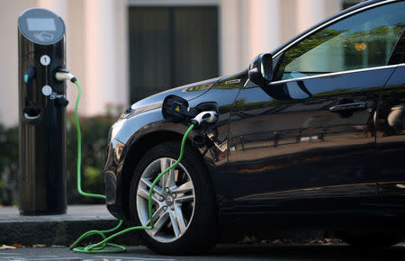 A Volvo hybrid car is seen connected to a charging point in London, Britain September 1, 2017. REUTERS/Hannah McKay