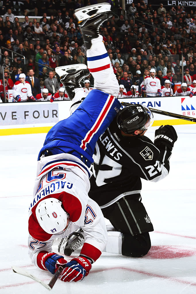 LOS ANGELES, CA - DECEMBER 4: Alex Galchenyuk #27 of the Montreal Canadiens gets checked and flips over Trevor Lewis #22 of the Los Angeles Kings during the game on December 4, 2016 at Staples Center in Los Angeles, California. (Photo by Juan Ocampo/NHLI via Getty Images)
