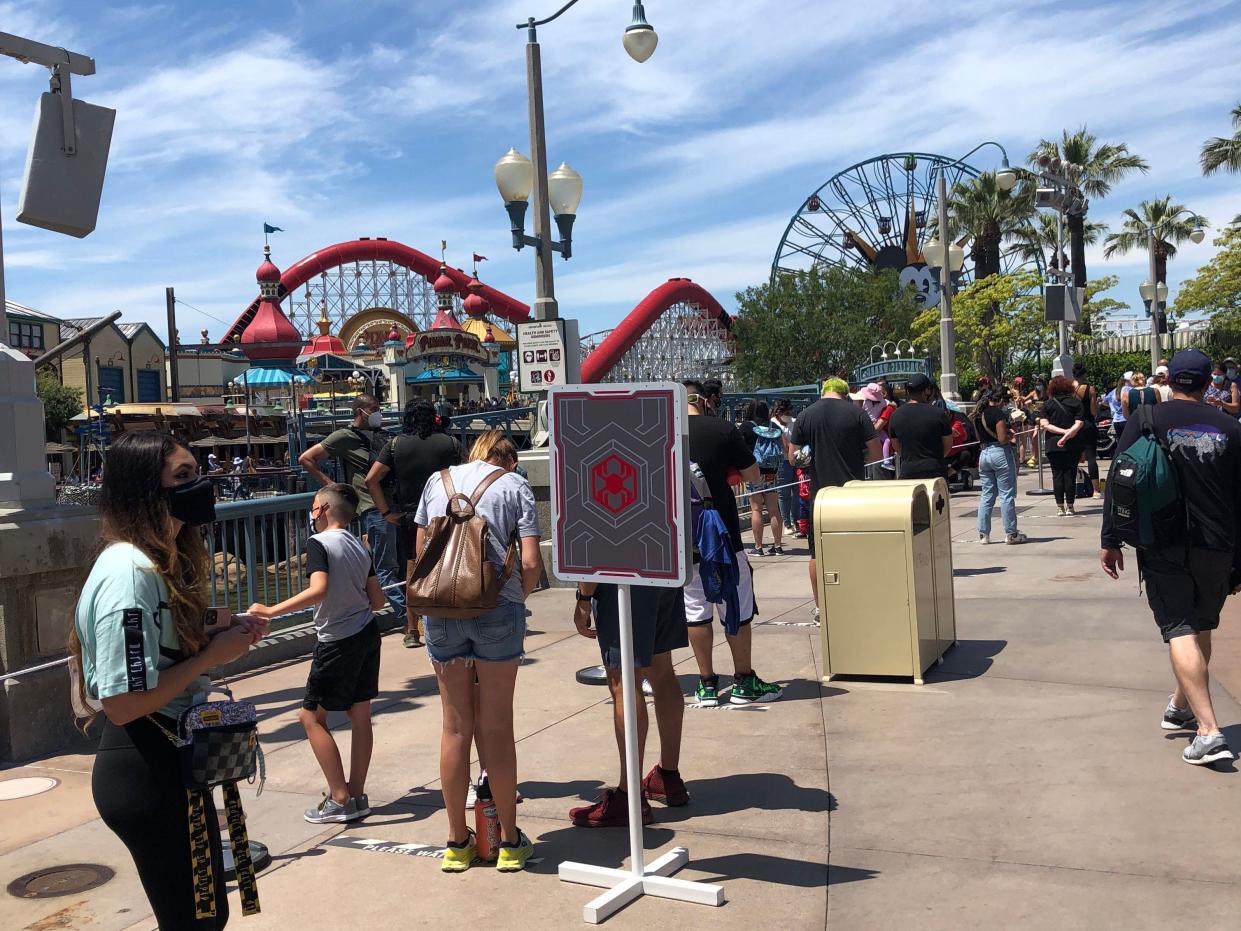 People waiting in line at a theme park
